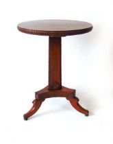 A Regency mahogany occasional table, the circular top with applied match striker edge, on a