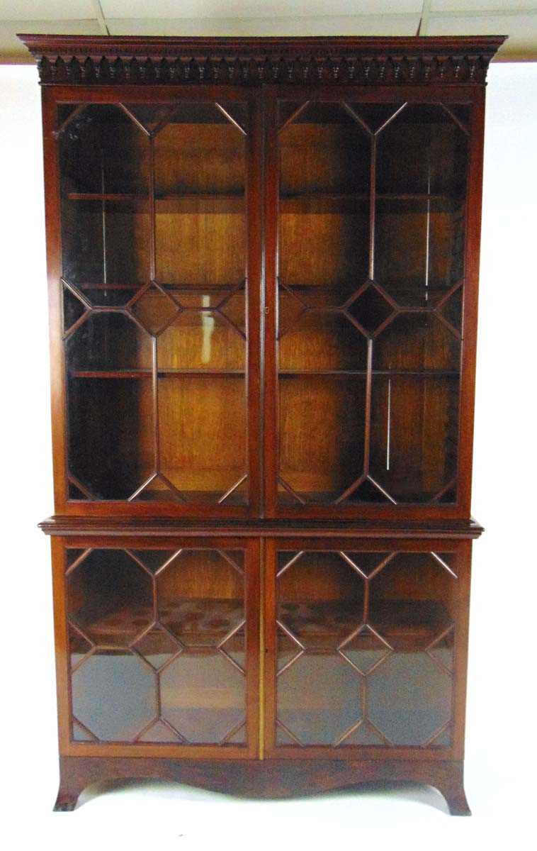 An Edwardian mahogany astragal glazed display cabinet, the pediment with dentil and pendant pilaster