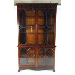 An Edwardian mahogany astragal glazed display cabinet, the pediment with dentil and pendant pilaster