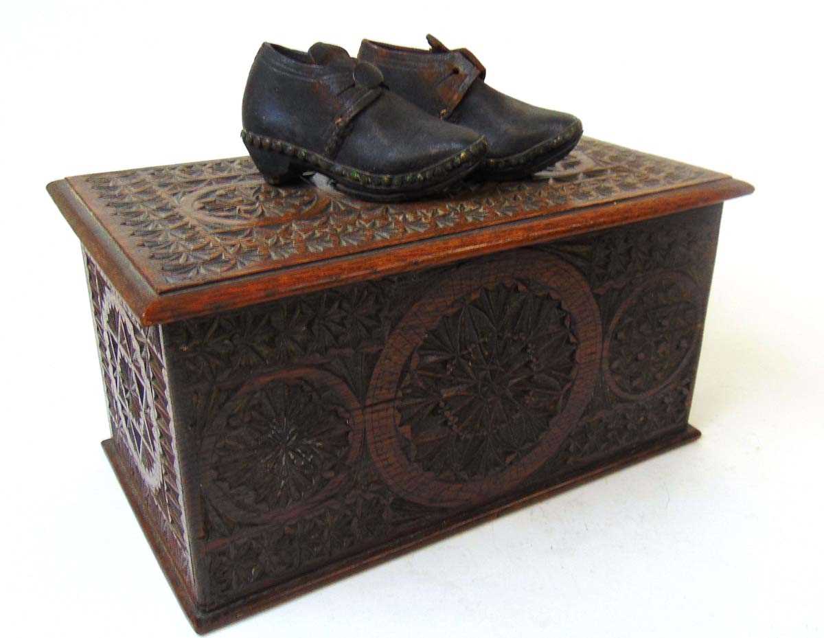 A Victorian chip carved oak candle box, carved throughout with roundels and geometric bands, and a