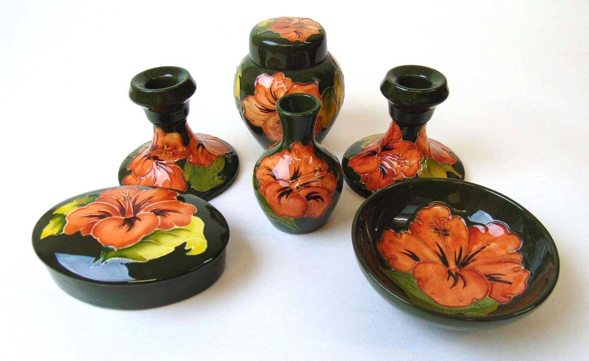 A group of 'Hibiscus' pattern Moorcroft, late 20th century, all on a green ground, impressed