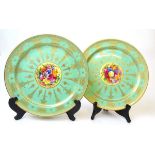 A pair of Royal Worcester hand painted cabinet plates, the centre with floral bouquets, signed W H