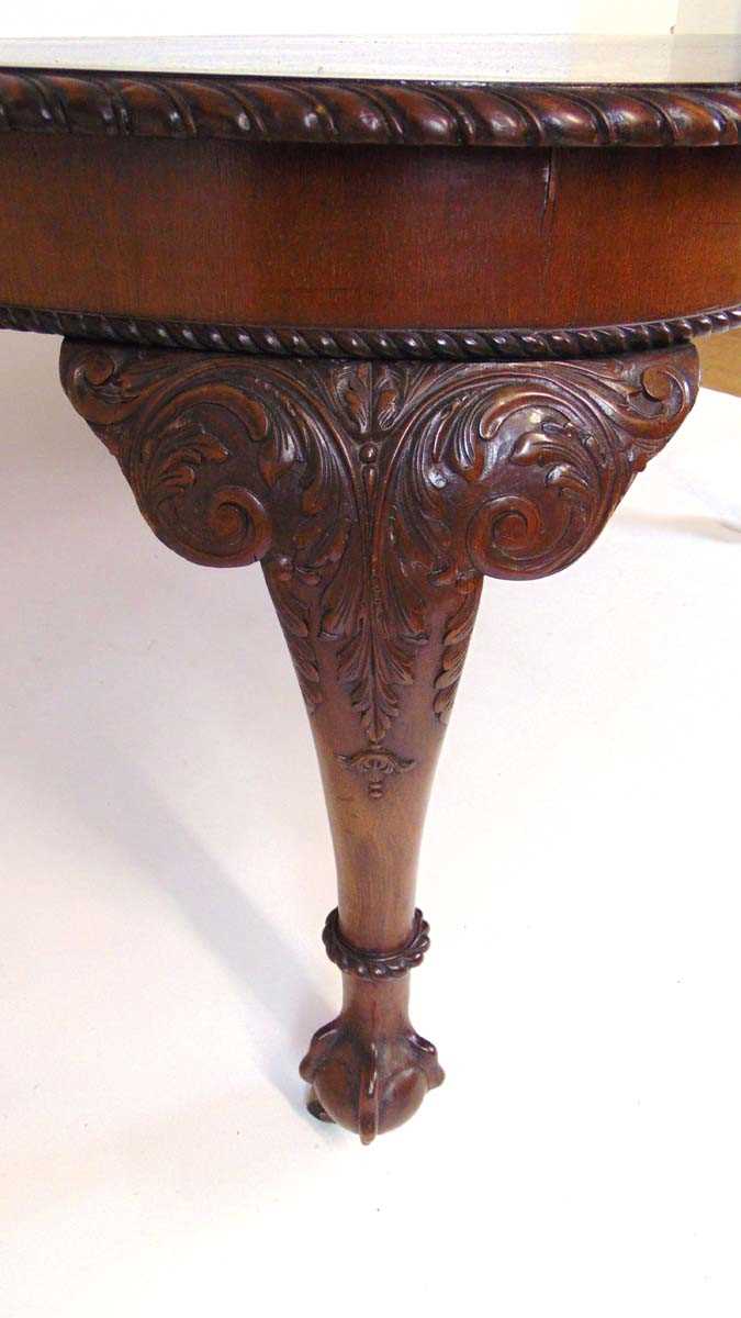 A mahogany extending dining table, early 20th century, with carved gadrooned edge, supported on four - Image 7 of 11