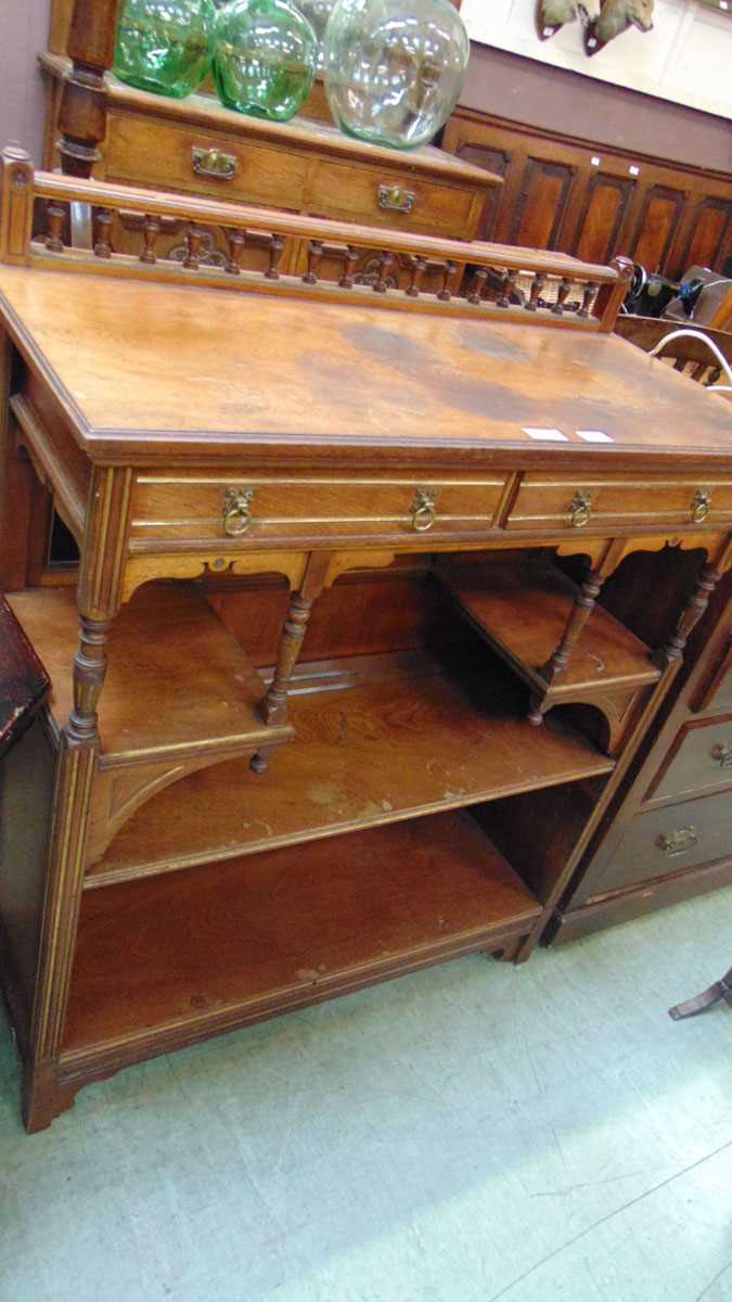 A Gillow & Co walnut side cabinet, 19th century, with spindle gallery above two short drawers in