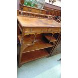 A Gillow & Co walnut side cabinet, 19th century, with spindle gallery above two short drawers in