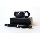 A Montblanc Meisterstuck fountain pen, with black polished resin body and gilt mounts, the 14k nib