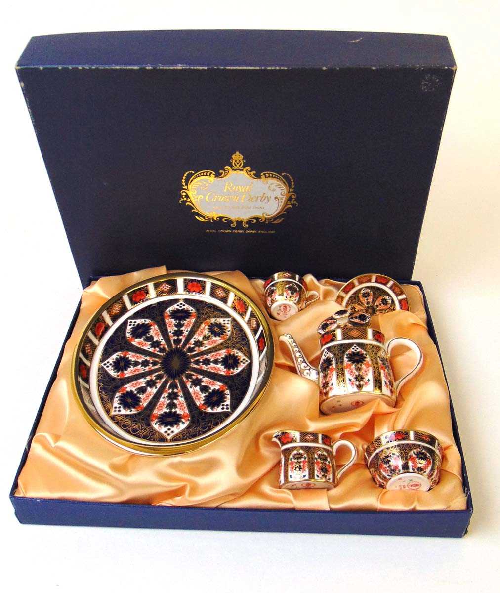 A Royal Crown Derby Imari pattern bachelor's miniature tea set, pattern 1128, in fitted presentation