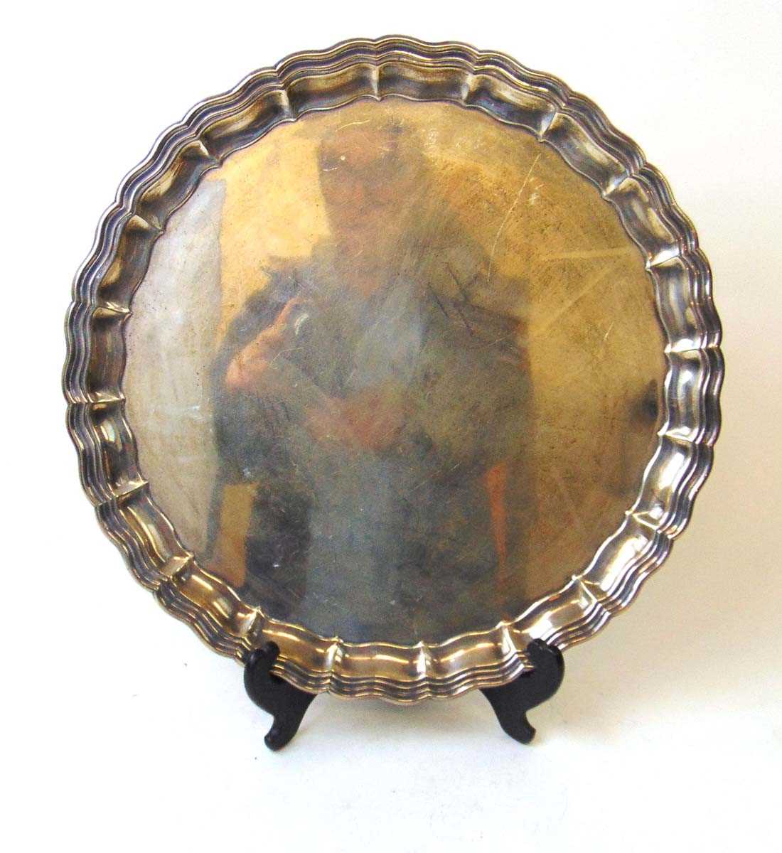 A large silver salver, Martin Hall & Co Ltd, Sheffield 1921, with raised edge on three scroll