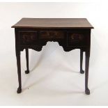 A George III oak lowboy, the top with moulded edge above three short drawers, on straight cabriole