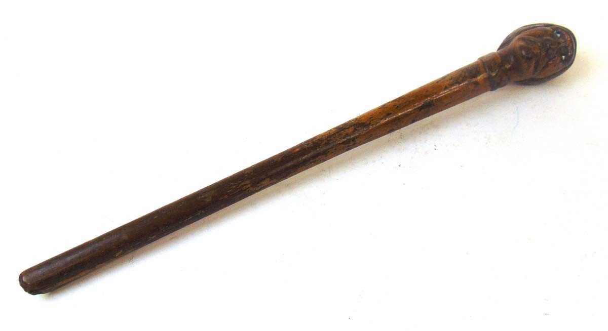 A continental carved wood walking stick handle, carved as a moustachioed man wearing a cap, with