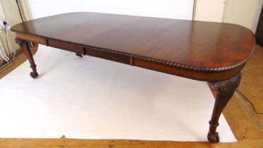 A mahogany extending dining table, early 20th century, with carved gadrooned edge, supported on four