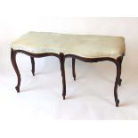 A Victorian mahogany duet stool, with watered silk upholstered seat with horsehair filling, above