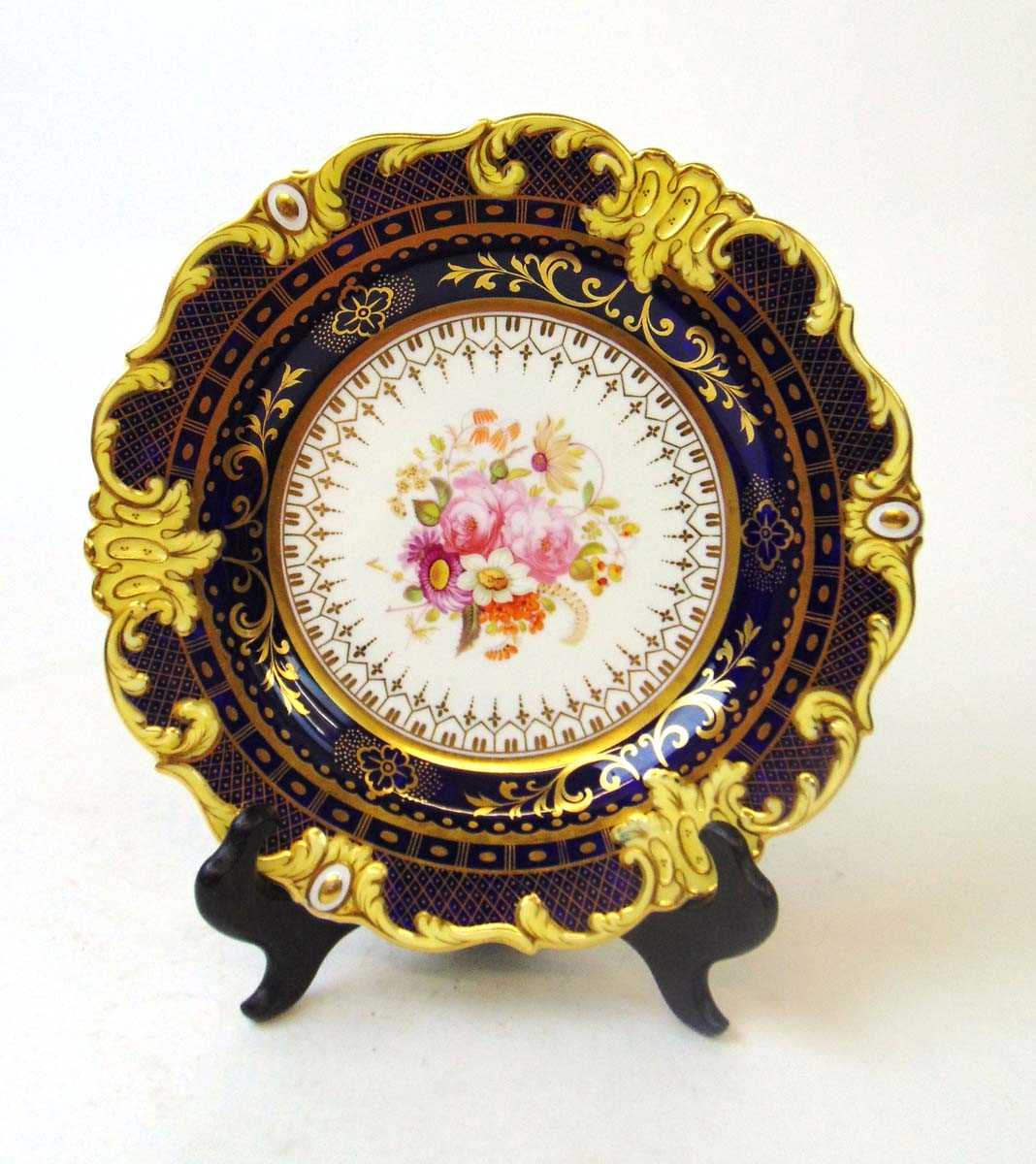 A 19th century English porcelain cabinet plate, with hand painted floral bouquet, within a royal