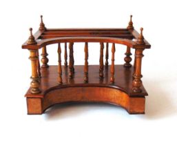 A converted Victorian walnut two division canterbury, with concave front and drawer, on ceramic