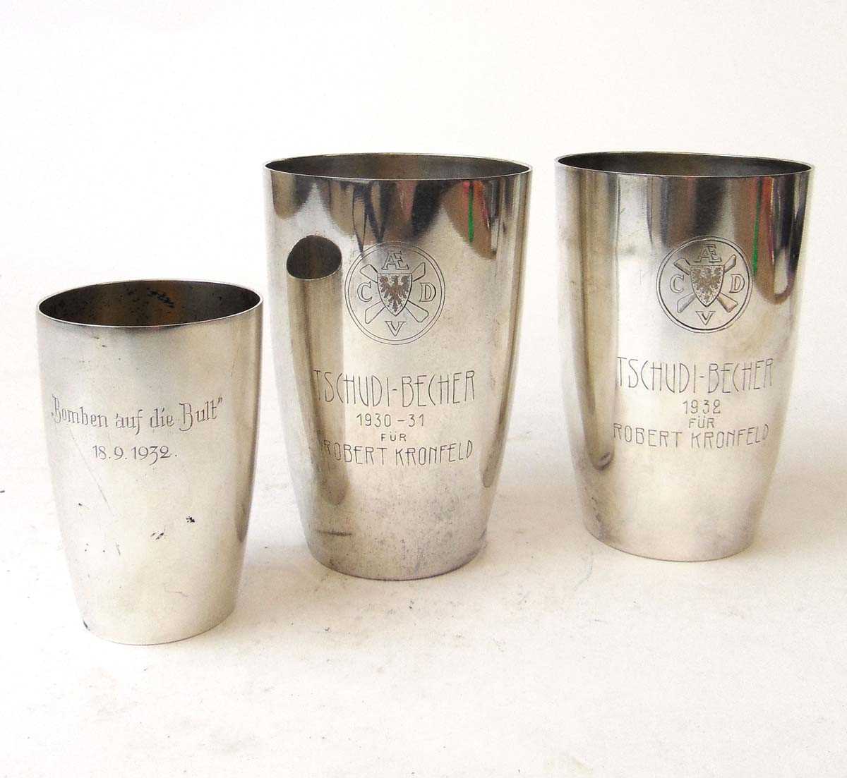 A pair of tall German silver beakers and a matching smaller beaker, Wagner & Sohn, the taller each