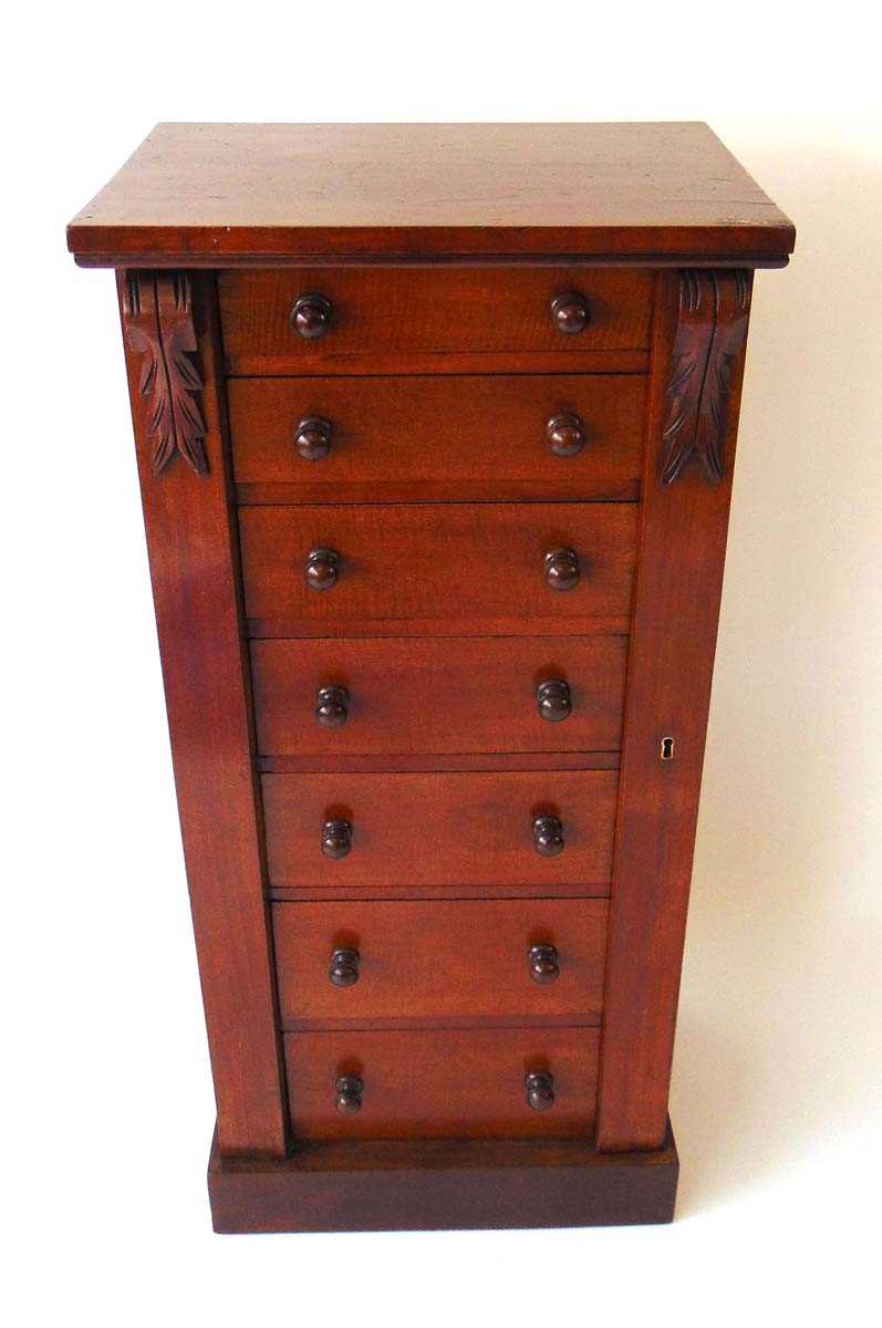 A Victorian mahogany Wellington chest, the seven drawers with turned knops, flanked by carved - Image 2 of 8