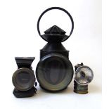 An early 20th century black painted railway lamp with revolving coloured lens, the cone stamped 5