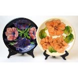 Two Moorcroft plates, in Hibiscus and Anemone patterns, late 20th century, 26cm diameter;