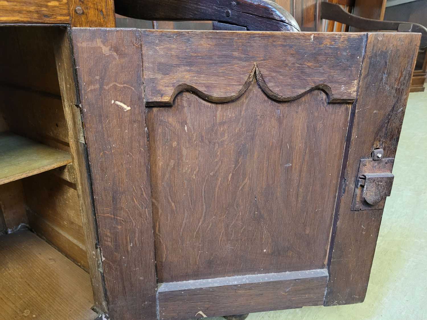 A George III oak Welsh dresser, with cavetto moulded pediment above the boarded back with three - Image 31 of 39