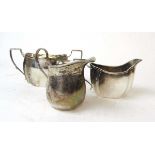 A silver cream jug with matching sugar bowl, Thomas Bradbury & Sons, Sheffield 1922; and a silver