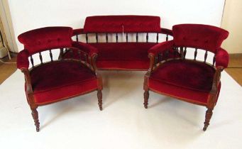 A late 19th century parlour suite, with walnut show frame and turned spindle backs, with foliate