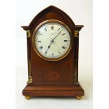 An early 20th century mahogany and inlaid mantel clock, retailed by Ollivant & Botsford, Manchester,