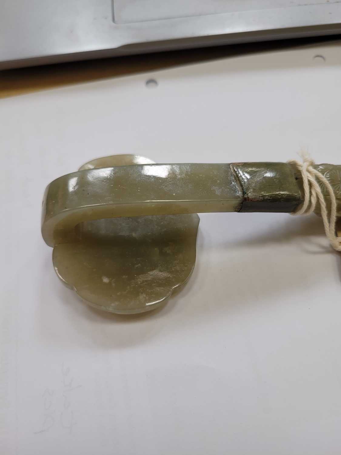 A Chinese carved jade section of a ruyi sceptre, Qing, the head carved with peaches on a leafy - Image 8 of 9