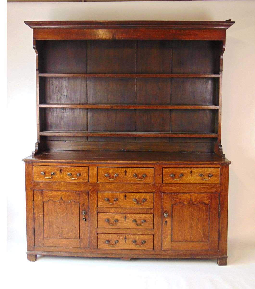 A George III oak Welsh dresser, with cavetto moulded pediment above the boarded back with three - Image 2 of 39