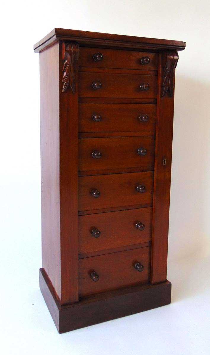 A Victorian mahogany Wellington chest, the seven drawers with turned knops, flanked by carved - Image 3 of 8