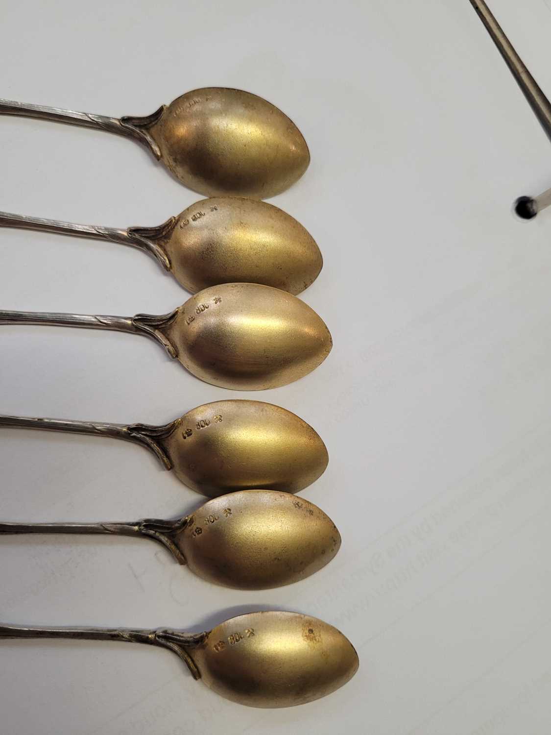 A set of six German silver teaspoons, the gilt bowls decorated with a butterfly, the terminals - Image 5 of 5