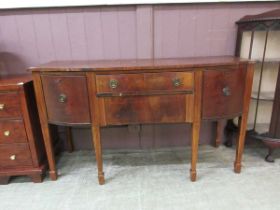 A 19th century flame mahogany sideboard, the two drawers flanked by cupboard doors on square
