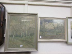 Two framed and glazed needleworks of wooded scenes