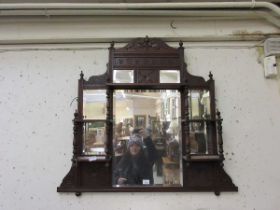 An Edwardian over mantle mirror with shelves above and flanking central mirror