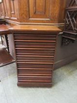 An early 20th century mahogany seven drawer music cabinet