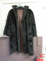 A black faux fur coat