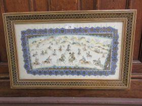 A framed and glazed possible Persian painted bone plaque depicting horse archery scene