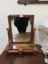 A walnut framed swing toilet mirror with two drawers to base