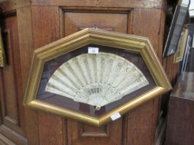 A gilt framed mounted hand fan