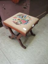 A Victorian mahogany stool with needlework upholstery seat