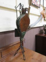 A pair of bellows, on a handcrafted chain design stand, together with fireside companion shovel