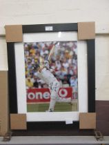 A framed and glazed signed photograph of cricket player Kevin Pietersen with certificate to back