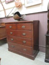 A Victorian stained pine chest of two short over three long drawers