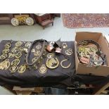 A box containing a large quantity of horse brasses, bells etc