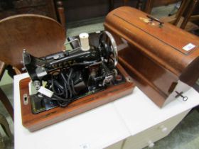 A Vesta electric sewing machine in a mahogany case