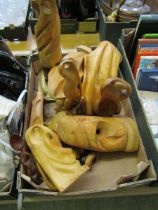 A tray containing hand crafted wooden statues