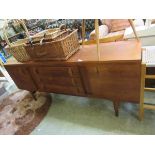 A mid century mahogany sideboard with three central drawers Dimensions: H, 73cm , W, 172cm , D,