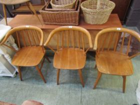 A set of three beech and elm seat stick back chairs (Possibly Swedish)