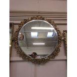 Circular gilt framed wall mirror