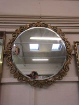 Circular gilt framed wall mirror