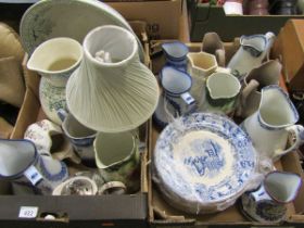 Two trays of ceramic jugs and various plates to include a washbowl